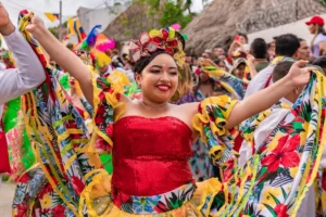 Woman dancing in a colorful traditional folklore costume during the cultural parade in chia.