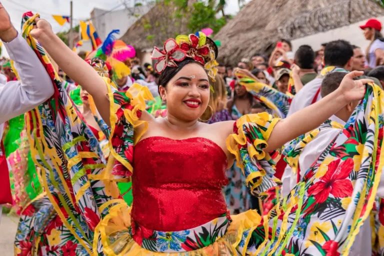 Woman dancing in a colorful traditional folklore costume during the cultural parade in chia.